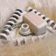 One prototype uses off-the-shelf bottle brushes, entangling a polar bear’s fur in its plastic bristles.